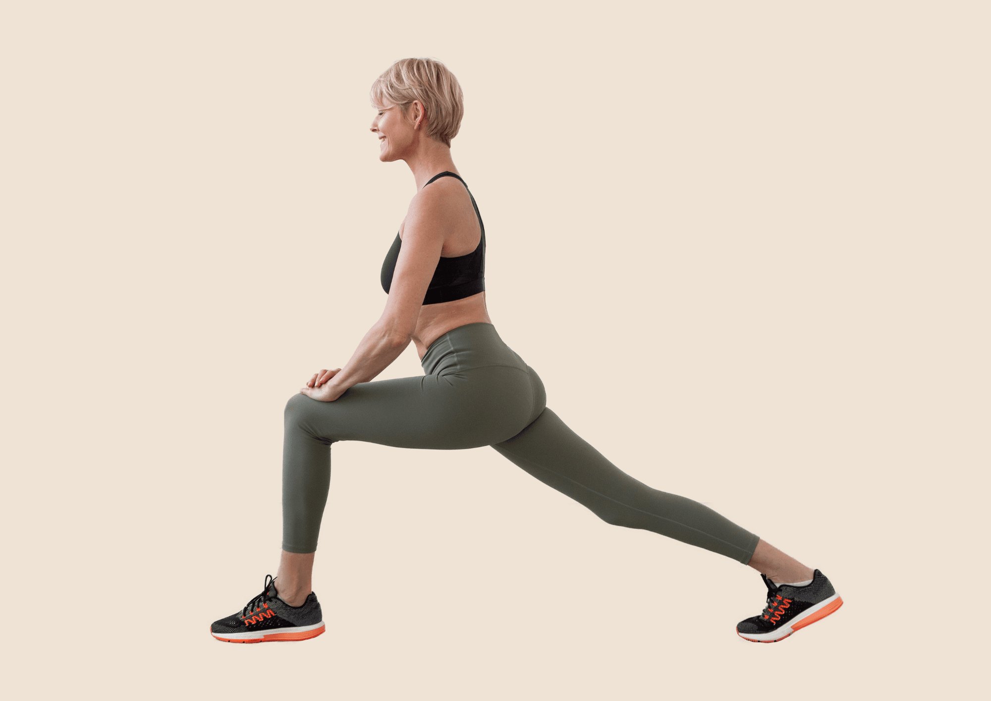Woman is smiling while doing stretching exercise.
